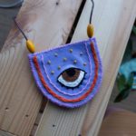 ADELA – Collar "ojo" con fondo malva